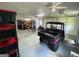 A large garage featuring a UTV and plenty of storage space along the walls at 360 Morgan Mill Rd, Brooks, GA 30205