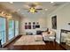 Bright living room with many windows, hardwood floors, a ceiling fan, and modern decor at 360 Morgan Mill Rd, Brooks, GA 30205