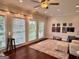 Bright living room with hardwood floors, a ceiling fan, and comfortable seating at 360 Morgan Mill Rd, Brooks, GA 30205