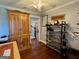 Cozy office space featuring custom shelves, desk area and hardwood flooring at 360 Morgan Mill Rd, Brooks, GA 30205