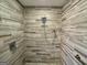 Sleek walk-in shower with designer tile walls and mosaic tiled flooring at 360 Morgan Mill Rd, Brooks, GA 30205