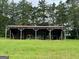 The backyard features a metal roofed storage shed perfect for storing outdoor equipment at 360 Morgan Mill Rd, Brooks, GA 30205