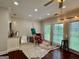 Light-filled studio space with hardwood floors, neutral colors, painting easel, and lots of natural light at 360 Morgan Mill Rd, Brooks, GA 30205
