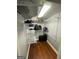 Functional walk-in closet with wire shelving provides organized storage space for travel bags and accessories at 360 Morgan Mill Rd, Brooks, GA 30205