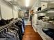Organized walk-in closet featuring wire shelving, hanging rods, and hardwood floors for ample storage at 360 Morgan Mill Rd, Brooks, GA 30205