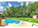This is a beautiful backyard with a pool and manicured lawn, perfect for outdoor entertaining at 245 Edenwylde Ct, Hampton, GA 30228