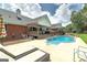 This is a backyard and pool area perfect for relaxing on the lounge chairs in the sun at 245 Edenwylde Ct, Hampton, GA 30228