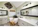 Stylish bathroom featuring a freestanding tub, double vanities, and modern fixtures at 245 Edenwylde Ct, Hampton, GA 30228