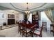 Beautiful dining room featuring a large table, decorative lighting, and elegant design elements at 245 Edenwylde Ct, Hampton, GA 30228