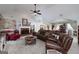Warm living room with fireplace, comfortable seating, and a decorative round coffee table at 245 Edenwylde Ct, Hampton, GA 30228