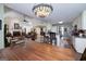 Spacious open-concept living space with dining area, kitchen, and living room areas at 245 Edenwylde Ct, Hampton, GA 30228