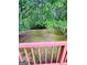 A view of the natural backyard perfect for enjoying outdoor living from the privacy of the deck at 35 Hampton Oaks Dr, Hampton, GA 30228