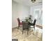 Bright dining area features tile floor and glass table, perfect for meals at 35 Hampton Oaks Dr, Hampton, GA 30228