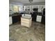 Bright kitchen features tile floors, black appliances, and white cabinetry at 35 Hampton Oaks Dr, Hampton, GA 30228