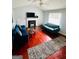 Bright living room with fireplace, hardwood floors, and vaulted ceiling at 35 Hampton Oaks Dr, Hampton, GA 30228
