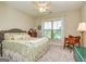 Comfortable bedroom with carpet, a ceiling fan, and a cozy decorative quilt on the bed at 326 Elkins Place, Peachtree City, GA 30269