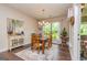 Charming dining area with wooden table, stylish rug, and natural light from the window at 326 Elkins Place, Peachtree City, GA 30269