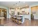 Modern kitchen with island, bar stools, and pendant lighting at 326 Elkins Place, Peachtree City, GA 30269