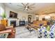 Open living space with fireplace, hardwood floors, and comfortable seating arrangement at 326 Elkins Place, Peachtree City, GA 30269