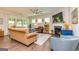 Cozy living room with fireplace, hardwood floors, and comfortable seating at 326 Elkins Place, Peachtree City, GA 30269