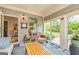 Relaxing sunroom with outdoor views, featuring cozy furniture and a tranquil ambiance at 326 Elkins Place, Peachtree City, GA 30269