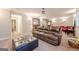 Finished basement featuring a comfortable leather sofa, entertainment area, and neutral carpet at 3502 Village Green Dr, Roswell, GA 30075