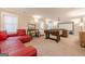 Spacious finished basement with recreation area, projector screen, and comfortable seating at 3502 Village Green Dr, Roswell, GA 30075