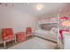 Bright bedroom with a bunk bed, light wood floors, and playful decor at 3502 Village Green Dr, Roswell, GA 30075