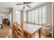 Spacious dining area with hardwood floors and large windows offers ample seating for Gathering and guests at 3502 Village Green Dr, Roswell, GA 30075