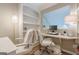 Bright home office featuring built-in shelving, a modern desk, and comfortable seating for two at 3502 Village Green Dr, Roswell, GA 30075
