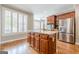 Bright kitchen featuring a center island, stainless steel fridge, and ample counter space at 3502 Village Green Dr, Roswell, GA 30075