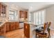 Modern kitchen offering a breakfast bar, stainless steel appliances, and tiled backsplash at 3502 Village Green Dr, Roswell, GA 30075