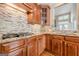 Close-up of kitchen with granite counters, tiled backsplash, and gas cooktop at 3502 Village Green Dr, Roswell, GA 30075