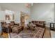 Spacious living room with high ceilings, leather seating, and an elegant area rug at 3502 Village Green Dr, Roswell, GA 30075