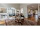 Inviting living room featuring a large rug, leather furniture, and decorative accents at 3502 Village Green Dr, Roswell, GA 30075