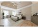 Calming main bedroom features neutral tones, tray ceilings, and great natural light from large windows at 3502 Village Green Dr, Roswell, GA 30075