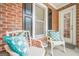 Inviting covered porch with comfortable seating, perfect for enjoying the outdoors in style at 3502 Village Green Dr, Roswell, GA 30075