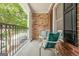 Covered front porch with chairs and decorative pillows, offering a relaxing outdoor space at 3502 Village Green Dr, Roswell, GA 30075