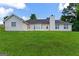Spacious backyard with a large lawn, perfect for outdoor activities and relaxation at 227 Ferguson Ave, Locust Grove, GA 30248