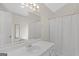 Bathroom with a single sink vanity, shower and neutral walls at 227 Ferguson Ave, Locust Grove, GA 30248