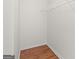 A walk-in closet with hardwood floors and wire shelving for storage and organization at 227 Ferguson Ave, Locust Grove, GA 30248