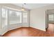 Bright dining area with large windows and wood-look flooring at 227 Ferguson Ave, Locust Grove, GA 30248