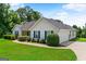 Beautiful home featuring a well-manicured lawn and an attached two-car garage at 227 Ferguson Ave, Locust Grove, GA 30248