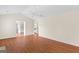 Bright living room with hardwood floors and a view of the kitchen at 227 Ferguson Ave, Locust Grove, GA 30248
