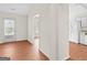 Bright living room with hardwood floors and a view of the kitchen at 227 Ferguson Ave, Locust Grove, GA 30248