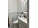 Clean and modern bathroom featuring a white vanity, updated fixtures, and stylish accessories at 6178 Graceland Cir, Morrow, GA 30260