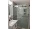 Well-lit bathroom with a modern vanity, sleek fixtures, and luxurious glass-enclosed shower at 6178 Graceland Cir, Morrow, GA 30260