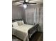 Stylish bedroom with a comfortable bed, soft bedding, modern light fixture, and cozy ambiance at 6178 Graceland Cir, Morrow, GA 30260