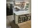 Modern kitchen featuring stainless steel appliances, quartz countertops, and open shelving at 6178 Graceland Cir, Morrow, GA 30260
