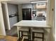 Well-designed kitchen featuring modern appliances, stylish island, and ample counter space at 6178 Graceland Cir, Morrow, GA 30260